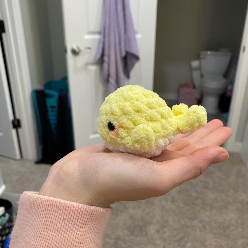 Yellow crochet pocket whale